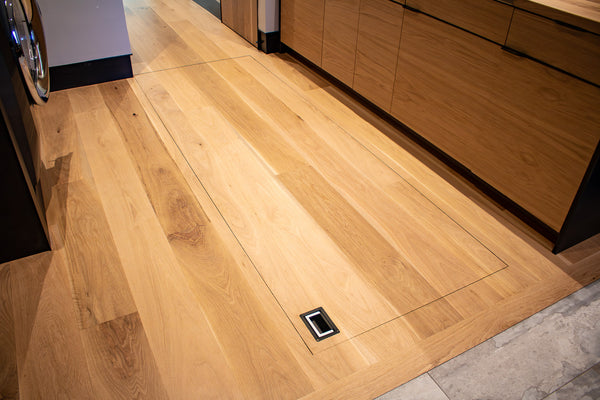 Floor Door Hinge System by Brandner Design is completely invisible from the outside.
