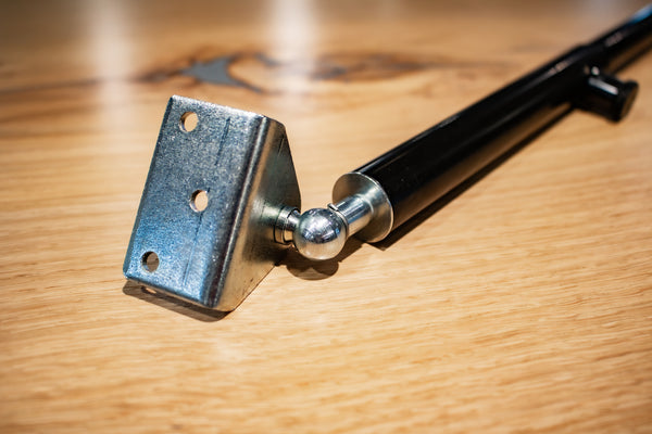 Floor Door Strut with installation plate close-up.