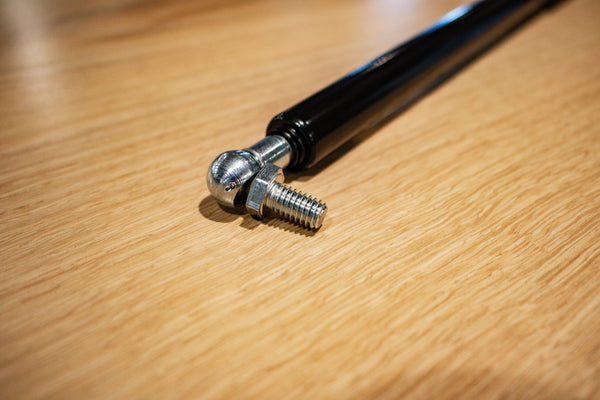 Hinge attachment screw on a Floor Door Strut.